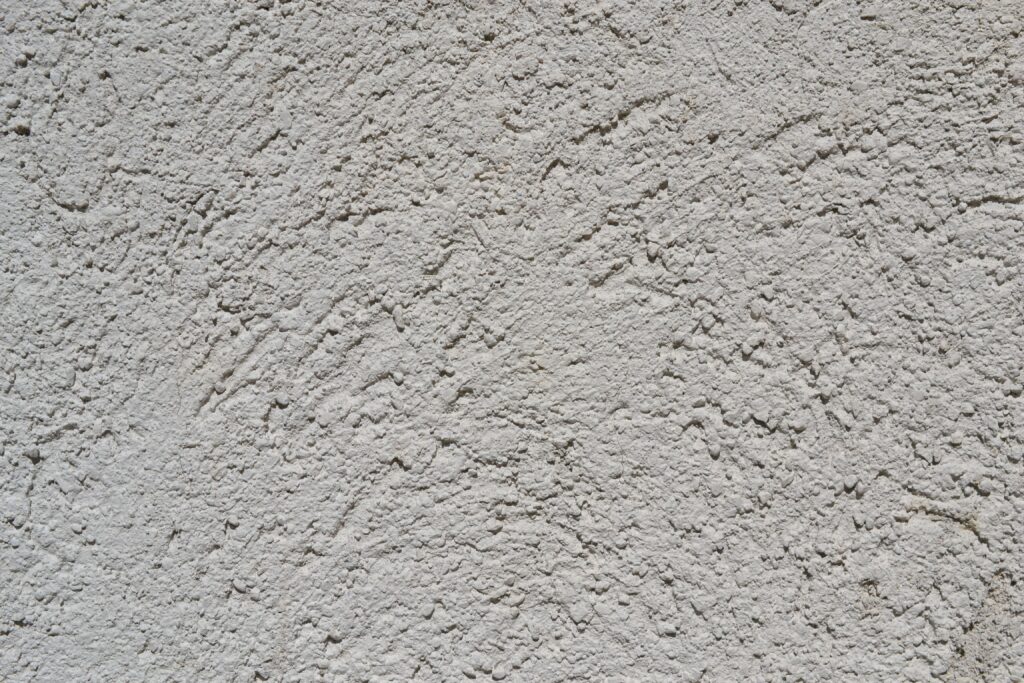 pexels-photo-12901948-12901948 Close-up of a light gray stucco wall texture, ideal for backgrounds.